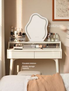 a bedroom with a white dresser and mirror