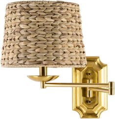 a wall light with a woven shade on it