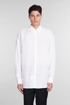 Valentino Shirt in white Cly, collar, long sleeves, frontal buttoning, curved hem, 100% lyocell, Made in Italy, Model is 183 cm and wears 48 White Shirt With Lapel Collar For Daywear, White Button-up Shirt With Concealed Placket, Modern White Shirt With Lapel Collar, White Long Sleeve Dress Shirt With Concealed Placket, Modern White Dress Shirt For Spring, Modern White Long Sleeve Dress Shirt, White Oversized Shirt With Lapel Collar, Valentino Shirt, John Lobb