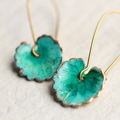 These leaf earrings are brass charms with some amazing detail, which have been carefully treated, painted and varnished to bring out beautiful tones and depth of colour and to show the incredible veining and other details of the metal.  These are coloured a beautiful, delicate and multi toned turquoise colour.  They are designed to be reminiscent of the beautiful, softly coloured lily pads found in Art Nouveau paintings. They are handmade in our Edinburgh studio and no two pairs are quite the sa Blue Leaf-shaped Jewelry Gift, Blue Leaf-shaped Jewelry For Gift, Turquoise Nature-inspired Drop Earrings, Blue Patina Earrings For Gift, Leaf-shaped Brass Earrings For Gift, Leaf-shaped Brass Earrings As Gift, Nature-inspired Turquoise Dangle Earrings, Turquoise Brass Earrings As Gift, Turquoise Brass Earrings For Gift