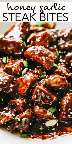 honey garlic steak bites in a white bowl with sesame seeds