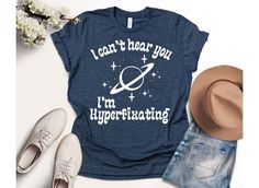 I Can't Hear You, I'm Hyperfixating Shirt, 0s Retro Aesthetic Shirt, Autism Shirt, Autism Lover Shirt, Neurodiverse Tee, Neurodiversity Gift We wish everyone to smile with our cute, stylish, and trendy graphic T-shirts. We assure you this shirt is the perfect gift whether you buy it for yourself or someone else. Autism Awareness, Equality Shirt, Neurodiversity Shirt, Autism Mom Tee Black text is only used for Athletic Heather, White, Baby Blue, Pink, Orange, Heather Peach, Yellow, Banana Cream, and Desert Pink colored shirts. White text is used for other colored shirts. Please review all the photos for the appearance of the designs on the shirts. Color and size charts are included in the listing photos. If you have any other design wish that you couldn't find in the shop, do not hesitate t Thick Hoodies, Desert Pink, Yellow Banana, Equality Shirt, Aesthetic Shirt, Banana Cream, Find Color