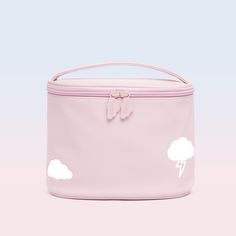 a pink bag with white clouds on it