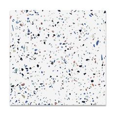 an abstract white background with blue, black and red speckles on the surface