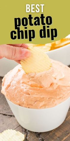 the best potato chip dip recipe in a white bowl with a hand holding a tortilla chip