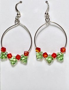 Red & green Swarovski crystal faceted Bicone  drop earrings with sterling hoop Sterling silver french hooks. These beautiful, multifaceted crystals have great sparkle! Handmade earrings have incredible sparkle and are suitable for all occasions and perfect gift for women. Great gift to show love and friendship.  Arrives in gift box ready for giving. Christmas, Hanukkah, Valentine's Day, Mother's Day, New Year Eve. Weddings, winter Birthday, any occasion for small gift. Arrives in gift box ready Faceted Beads Dangle Hoop Earrings For Gifts, Gift Teardrop Hoop Earrings With Faceted Beads, Green Dangle Crystal Earrings For Festive Occasions, Czech Glass Dangle Hoop Earrings As Gift, Green Hoop Earrings As A Gift, Faceted Beads Dangle Crystal Earrings Gift, Czech Glass Faceted Earrings For Gifts, Dangle Crystal Earrings With Faceted Beads As Gift, Faceted Czech Glass Earrings As Gift