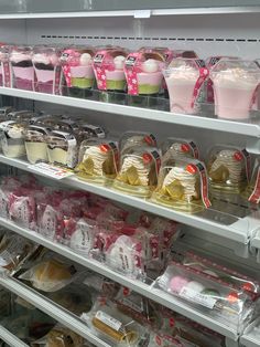 the shelves are filled with cakes and cupcakes in plastic bags, along with other packaged items