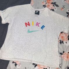 Nwot. Short Sleeve Sweater. Youth Xl. Fun Crew Neck Top With Logo Print, Playful Nike Crew Neck T-shirt, Nike Gray Tops With Letter Print, Playful Gray Top With Graphic Print, Playful Gray Graphic Print Top, Nike Gray Cotton Tops, Playful Nike Crew Neck Top, Playful Nike Short Sleeve Tops, Cute Nike Short Sleeve Tops