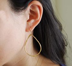 Gold plated teardrop hoops measure 2 inches in length and 1.25 in width. The ear hook is 14k gold fill. Also available in silver. These are great everyday earrings. Item comes packaged in a little brown box. Gold Hypoallergenic Teardrop Earrings For Everyday, Everyday Gold Teardrop Hoop Earrings, Gold Teardrop Threader Earrings For Everyday, Gold Long Drop Teardrop Earrings For Everyday, Everyday Gold Long Drop Teardrop Earrings, Everyday Long Drop Gold Teardrop Earrings, Modern Teardrop Hoop Earrings As Gift, Gold Teardrop Earrings For Everyday, Yellow Gold Teardrop Hoop Earrings With Ear Wire