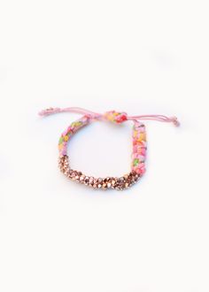 "Rose Gold Cluster Nugget Bracelets are handmade in New York City with Pink Bandana. Prasada in Sanskrit means \" God's blessing\". Nugget is a symbol of good fortune. Prasada bracelet is a nice gift with a great intention for yourself and your beloved. Meanwhile, it adds a romantic bohemian touch to your wrist to complete a casual chic look. The length of the bracelet is adjustable." Handmade Adjustable Charm Bracelet For Festivals, Pink Adjustable Spiritual Braided Bracelet, Pink Hand-strung Braided Bracelets As Gift, Bohemian Pink Beaded Bracelets With Sliding Knot, Pink Bohemian Beaded Bracelet With Sliding Knot, Pink Bohemian Jewelry For Friendship, Festival Jewelry With Colorful Beads As Gift, Festival Jewelry With Colorful Beads For Gift, Handmade Adjustable Rose Gold Crystal Bracelet