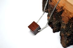 "Minimalist Cube Wood Pendant- Unique Wood bead Necklace - Choose your chain style and length  Cube Pendant measures 10mmX10mmX10mm LENGTH - You can select your desired length from the options drop-down choices or message me for a custom length. (If you do not leave me a note, I will send you a 28\" chain ) :) - Lengths 26\" and shorter will close with a clasp. Above 26\" have no clasp CHAIN STYLE -Select your desired style of chain from the option drop-down choices Or Convo me. QUALITY Affordable Jewelry doesnt need to look cheap! I take care in choosing my materials and only craft things I would want to wear myself. I carefully selected the chains. They are very study and durable. D E L I V E R Y / G I F T All items are made to order. I usually make the item the same day you order and ge Minimalist Brown Jewelry As A Gift, Minimalist Brown Jewelry As Gift, Minimalist Brown Jewelry For Gift, Minimalist Brown Necklace For Gift, Minimalist Brown Necklace For Gifts, Minimalist Brown Necklaces For Gifts, Minimalist Silver Chain Necklace With Square Pendant, Minimalist Brown Necklace For Everyday, Minimalist Brown Sterling Silver Jewelry