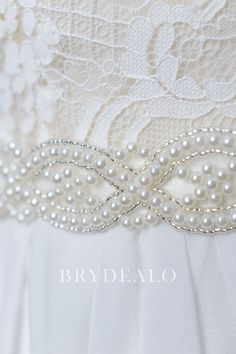 This charming and elegant bridal self-tie bridal sash belt features statement pearls embellished on the ivory satin in chic wave pattern. A nice accessory for your wedding gown. content satin, beading, pearls embellished portion length 45cm, width 3cm ribbon length 275cm, width 2cm Elegant Pearl Embellished Sashes For Party, Elegant White Bride Sashes, Elegant Bridal Accessories With Pearl Embroidery, Elegant Pearl Embroidered Bridal Accessories, Elegant Bridal Sashes For Bride, Elegant Bridal Sashes, White Bridal Accessories With Sashes, Elegant White Bridal Belt, White Satin Bridal Belt With Sashes