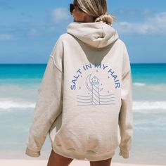 ✨ This hoodie is all about good beachy vibes. A fun little expression to add a smile to your face. ✨ The design is laid-back and casual, perfect for those lazy days or casual outings. This unisex heavy blend hooded sweatshirt is cozy and comforting all in one. Made with a thick blend of fabrics, it feels plush and soft, a perfect choice. The front has a spacious pocket that adds convenience. Also includes a drawstring on the hood itself. ☀️ SIZING☀️ ⚡️ Size up 2 sizes for oversized fit ⚡️ Unisex Summer Vacation Cotton Hoodie, Cotton Hoodie For Summer Vacation, Vacation Hoodie With Relaxed Fit And Long Sleeves, Hooded Cotton Top For Vacation, Cotton Hooded Top For Vacation, Relaxed Fit Long Sleeve Hoodie For Vacation, Spring Vacation Long Sleeve Hoodie, Summer Casual Hoodie With Letter Print, Trendy Hooded Hoodie For Beach Season