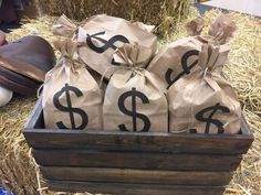 bags of money sitting on top of hay