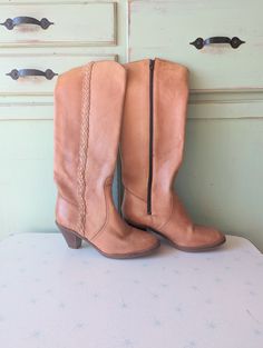 "good vintage condition killer boots tan leather tall boots size 7 womens (7M) 9\" tip to tip (taken at bottom of shoe) 3 1/4\"ball 17\"tall 2.5\"heel Thank YOU and please feel free to ask me any ?s:) Have a lovely day xoxo www.etsy.com/shop/retroandme" Vintage Wide Calf Knee-high Boots, Vintage Wide Calf Knee-high Boots For Fall, Retro Wide Calf Boots For Fall, Vintage Brown Knee-high Boots For Fall, Retro Knee-high Leather Boots, Vintage Wide Calf Knee-high Heeled Boots, Retro Knee-high Boots For Fall, Retro Knee-high Fall Boots, Retro Wide Calf Leather Boots