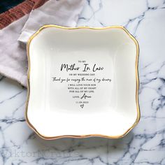 a mother's love dish on a marble surface with a poem written in it