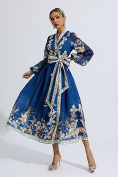 The Miley Blue Floral Belted Long Sleeve Dress is a timeless piece that exudes elegance. With a retro-inspired wrap design, this dress is perfect for any occasion. Its floral print adds a touch of femininity, while the belted waist enhances your silhouette. Made from high-quality materials, this long sleeve dress is both comfortable and flattering. Whether you're attending a formal event or a casual outing, this dress will make you stand out in style.  Dress Length: Approx 132cm Materials: Polye Glitter Wedding Dress, Lace Up Dress, Bandage Midi Dress, Floral Shirt Dress, Puff Sleeve Dresses, Maxi Knit Dress, Lantern Sleeve, Ruched Dress, Dress Size Chart