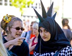 two women dressed in costumes talking to each other with caption that reads, it's hard to muslim and punk