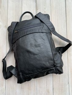 "Very light Leather Backpack, Recycled Leather Rucksack, Black Backpack LeaF minimalist light women's leather backpack is made from high quality upcycled leather. Most of our works are in minimalist design and suits for everyday or special events. LeaF leather backpacks are very light and not overloads your back. If you need to carry only a few things, this convertible backpack purse could be used as clutch - just roll it or fold it. Minimalist design leather backpack fits 13\" laptop. FEATURES Functional Soft Leather Everyday Backpack, Functional Soft Leather Backpack, Functional Soft Leather Backpack For Daily Use, Everyday Functional Soft Leather Backpack, Soft Leather Backpack For Commuting, Black Leather Backpack Soft Leather, Functional Backpack With Leather Backing For Everyday Use, Functional Leather Backpack With Waxed Finish For Daily Use, Everyday Leather Backpack