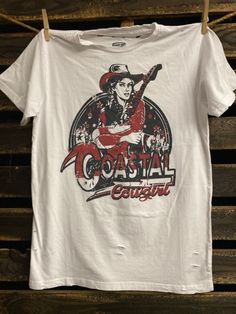 Country Deep Coastal Cowgirl Distressed Unisex Tee - Pigment Dyed 40 Singles Jersey 100% Cotton Premium quality ringspun and compacted cotton Fine Cotton Jersey that is pigment dyed for a more vintage look Features tears and destroyed features at neck and on body Each piece is unique as this process is done by hand! 3.8 oz Made In USA Every garment dye item can be a slightly different shade in color since this is a laundry dye process. Enjoy its unique quality! SIZE CHART SMLXL2X Width192021.523 White Distressed Grunge T-shirt, Grunge Pre-shrunk Cotton T-shirt, Distressed Cotton Band Merch T-shirt, Distressed Cotton T-shirt Band Merch, Acid Wash Cotton Band Merch T-shirt, Distressed Cotton Tri-blend Tops, Distressed Cotton Grunge T-shirt, Western Grunge, Vintage Coastal