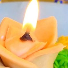 a close up of a candle on a plate