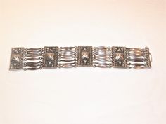 I Love this Bracelet. 8 Inches long and 34mm wide or almost 1.5 inches wide. This Bracelet is awesome and weighs 57 grams of solid 925 Sterling Silver. Although this is an older Vintage or Antique Bracelet it is still in great condition. It was built to last for sure. I Tested this Piece very well and I will Guarantee the 925 Sterling Silver Purity or your Money back. Items like this made with a High Purity of Silver will last you a Lifetime and will also hold on to a Great Value for your Future Rectangular Silver Jewelry With Bracelet Strap, Silver Rectangular Jewelry With Bracelet Strap, Antique Bracelets, Palm Coast, Wide Bracelet, Sterling Silver Bracelet, Italian Charm Bracelet, Chain Link Bracelet, Solid 925 Sterling Silver