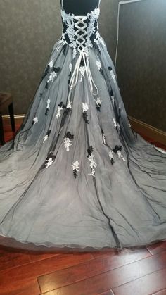 a wedding dress on display in a room