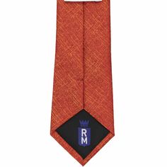 Gentlemen, this tie elevates the classic solid color look. This modern burnt orange tie features a textured crosshatch pattern in a slightly lighter (and complementary) shade. Our customers are wearing this one to the office and for weddings. For up-to-date style, wear it with a navy blue or gray suit; you won't regret it! Here's what you're getting with this tie. It's made from an equal blend of cotton and silk. The fabric is woven and heavyweight, which is great for achieving that perfect tie Orange Formal Suit And Tie Accessories, Orange Standard Tie For Business, Elegant Orange Tie For Business, Orange Standard Business Tie, Elegant Orange Suit And Tie Accessories For Formal Occasions, Classic Orange Ties For Business, Classic Orange Tie For Business, Orange Business Tie, Orange Tie