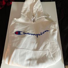 Mens Champion Hoodie, Color-White, Size-Medium, Never Worn, Still Has Tags On It, Soft Sports White Hoodie With Letter Print, White Fleece Hoodie With Adjustable Hood, White Crew Neck Sweatshirt With Drawstring Hood, White Hoodie With Logo Print For Winter, White Sports Hoodie With Adjustable Hood, White Logo Print Hoodie For Winter, White Crew Neck Sweatshirt With Adjustable Hood, White Crew Neck Hoodie With Logo Print, White Fleece Hoodie With Logo Print