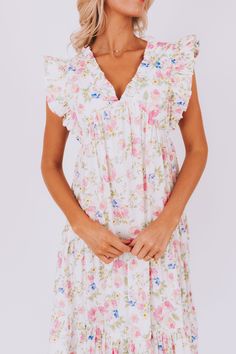 This flirty Take Me Back Dress is the perfect way to add some floral fun to your wardrobe. With a flattering V-neckline and playful ruffle details, you'll turn heads wherever you go. Don't miss out on this must-have piece. Details Floral pattern V-neckline Ruffle details Sizing Approximate measurements: SIZE LENGTH BUST Small 47" 38" Medium 48" 40" Large 49" 42" Fabric has no stretchModels are 5’10 wearing small Material 100% CottonHand wash coldHang to dry Feminine Ruffle Dress For Spring Vacation, Flirty Spring Mini Dress With Flutter Sleeves, Floral Print Mini Dress With Ruffle Sleeves For Brunch, Spring Floral Print Ruffle Dress For Day Out, Feminine Floral Dress With Ruffles For Vacation, Flowy V-neck Ruffle Dress For Garden Party, Floral Print Dresses With Ruffled Straps For Daywear, Daywear Dresses With Floral Print And Ruffled Straps, Spring Feminine Ruffle Dress For Daywear