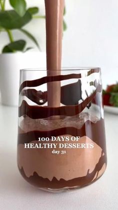 a chocolate dessert is being poured into a wine glass with the words 100 days of healthy desserts written on it