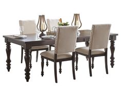 a dining room table with chairs and plates on it in front of a white background