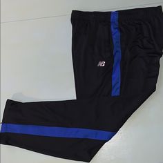 Brand New With Tags. Size Xxl. Black With Blue Stripe Black New Balance Sports Bottoms, New Balance Black Bottoms For Sports, New Balance Black Sports Bottoms, New Balance Sporty Black Bottoms, New Balance Black, Blue Stripes, Track Pants, New Balance, Black Blue