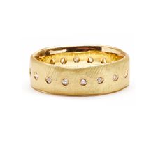 a gold ring with diamonds on it