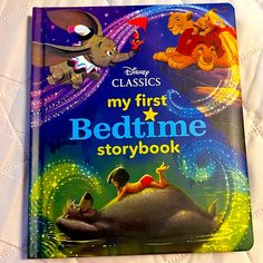 the book cover for my first bedtime storybook with an elephant and other animals