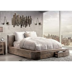 a bedroom with a bed, nightstands and large window overlooking the cityscape