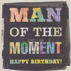 a sign that says man of the moment, happy birthday with colorful writing on it