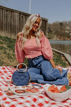 There is no better piece to celebrate America in than this flirty top featuring lightweight material patterned with a small red and white gingham print and navy and white flowers, a smocked button down bodice, a straight neckline with tie closure spaghetti straps, loose 3/4-length drop sleeves with cold shoulder cutouts, and a flattering figure hugging silhouette that ends in a straight but ruffled hemline!  on products  Measurements S variant has  a Bust of 28",  a Length of 14.5",  a Sleeve Le Chic Gingham Smocked Top For Summer, Spring Chic Gingham Smocked Top, Spring Gingham Smocked Top For Day Out, Summer Picnic Top With Smocked Bodice, Summer Smocked Top For Picnics, Summer Smocked Bodice Top For Picnic, Summer Smocked Top With Smocked Back For Picnic, Summer Smocked Top For Picnic With Smocked Back, Summer Smocked Top For Picnic