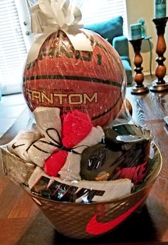 a basket filled with sports items on top of a wooden table