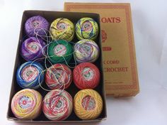 there are many balls of yarn in the box