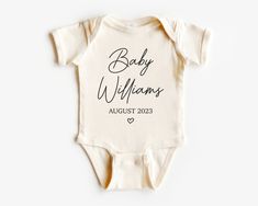 Welcome your little one with this adorable "Coming Soon" onesie. Customizable with your own personalized message, this soft-as-a-cloud bodysuit is the perfect way to announce your newest family member! Show your love with a unique and special gift! Products Detail: 100% combed ring-spun cotton (fiber content may vary f Cute Cotton Onesie With Custom Print, Personalized Newborn Onesie, Customizable Cotton Onesie, Coming Soon Onesie, Onesie With Name, Onsie Pregnant Announcement, Announcement Ideas, Organic Baby Clothes, Long Sleeve Onesie