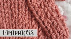 a close up of a knitted object with the word dimmingos written on it