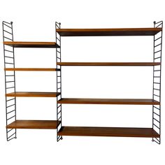 two shelving units with wooden shelves on each side