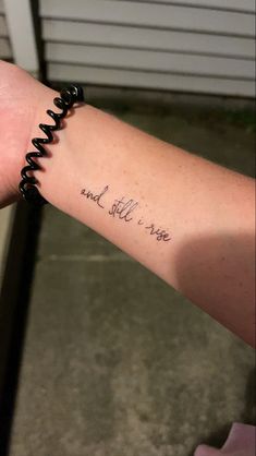 a person's arm with a tattoo that says and still is true on it