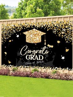 graduation backdrop with gold confetti and black background