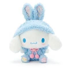 a small stuffed animal with bunny ears on it's head, sitting against a white background