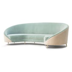 a curved couch with metal legs and a light green upholstered back, on a white background