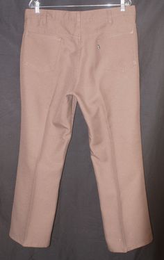 Here's a pare of super sweet 1970's Levi's wide leg pants you'll love adding to your vintage leisure and western wear collection. Wear these original polyester Levi slacks to casual and dressy and everyday affairs alike - you'll be a cool cat wherever. These classic authentic Levi's vintage black and gold tab, wide/flared, polyester hip trousers are a versatile wardrobe basic you'll wear forever. They are in really great overall vintage condition with slighter signs of wearing and these western Western Style Bottoms With Belt Loops For Fall, Western Full-length Fall Bottoms, Western Style Full Length Bottoms For Fall, Cowboy Dress, 80s Western, Brown Slacks, Levis Pants, Versatile Wardrobe, Leg Cuffs