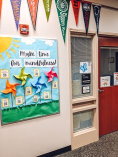 an office decorated with colorful flags and decorations