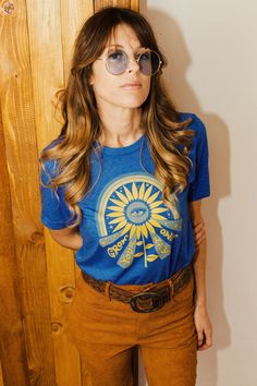 womens graphic tees - grow your own way 70s graphic tee for women vintage hippie t shirt retro tees retro graphic tees for women sunburst Our Grow Your Own Way tee is for those of us seeking to be our true selves in a world that doesn't always accept authenticity and individuality. The design features all the 70s vibes and was created for all the hippies at heart. Size Guide: Our Grow Your Own Way tee comes in a Unisex style on Heather Royal Blue. Please refer to the provided tee measurements gi Hippie T Shirt, Bohemian Diesel, Womens Graphic Tees, Graphic Tees For Women, Hippie T Shirts, Retro Graphic Tees, Butterfly Shirts, Vintage Hippie, Graphic Tees Vintage